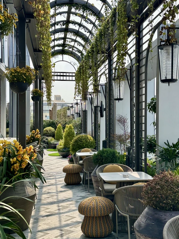 Plant-filled outdoor terrace at The Rooftop Bar at Andaz Shanghai ITC