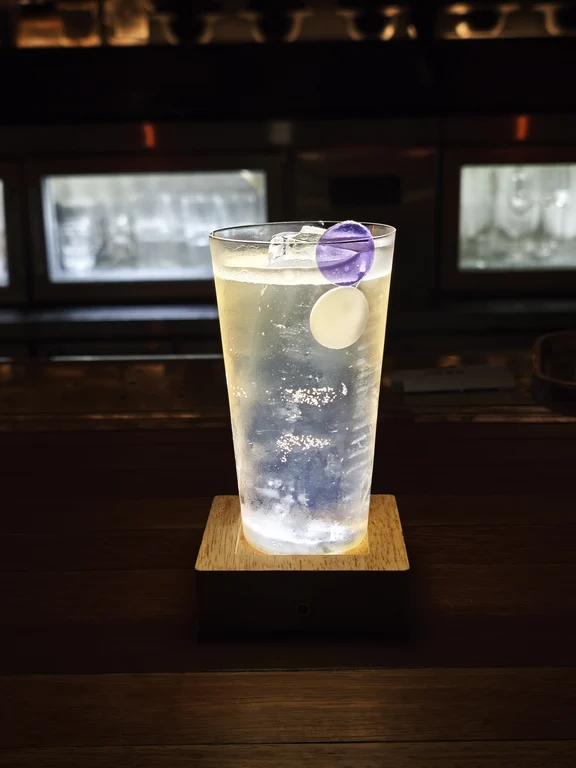 Tropical cocktail with a purple garnish at FLAVOR TIKI in Chongqing
