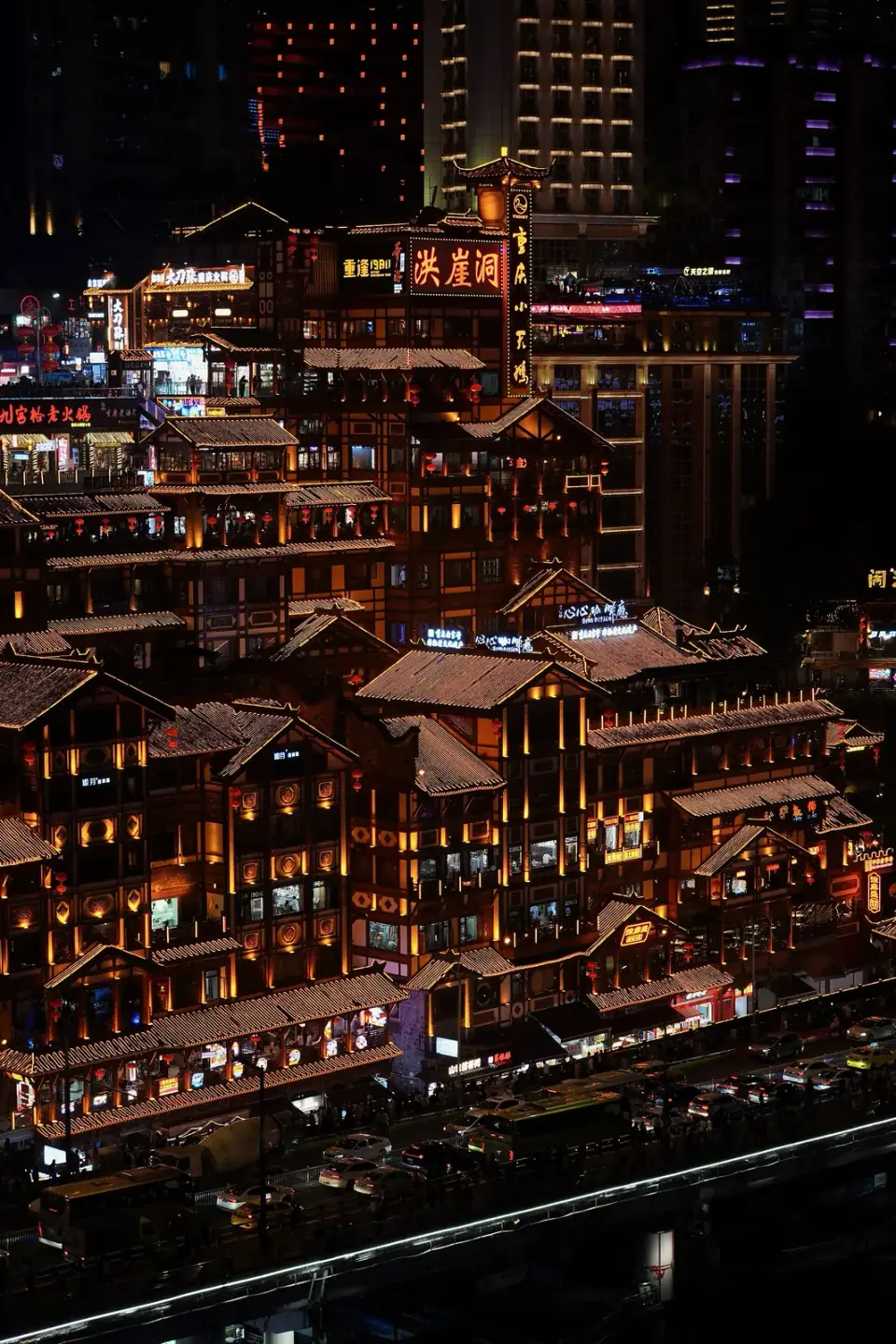 Hongyadong’s illuminated traditional buildings beside the river in Chongqing