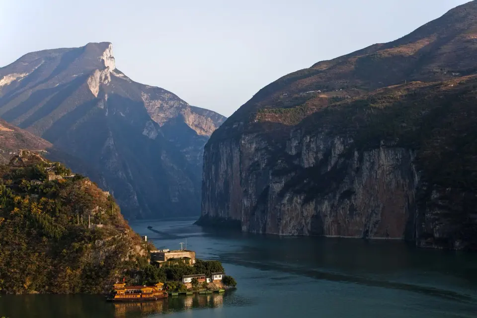 The Yangtze River passing between steep mountain cliffs in Qutang Gorge