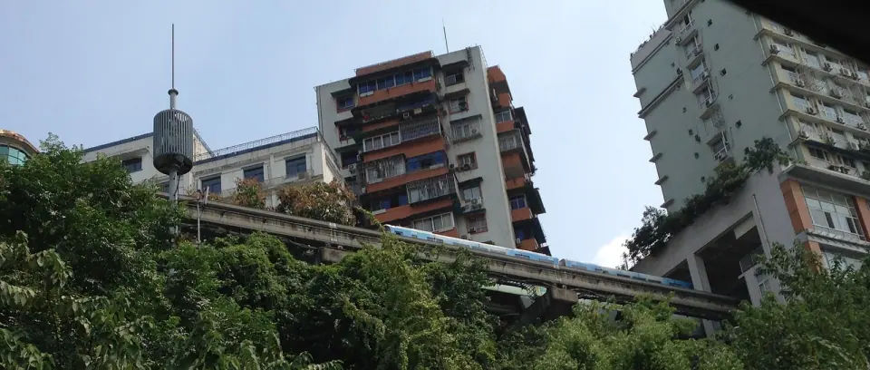 Chongqing monorail entering an apartment building at Liziba Station