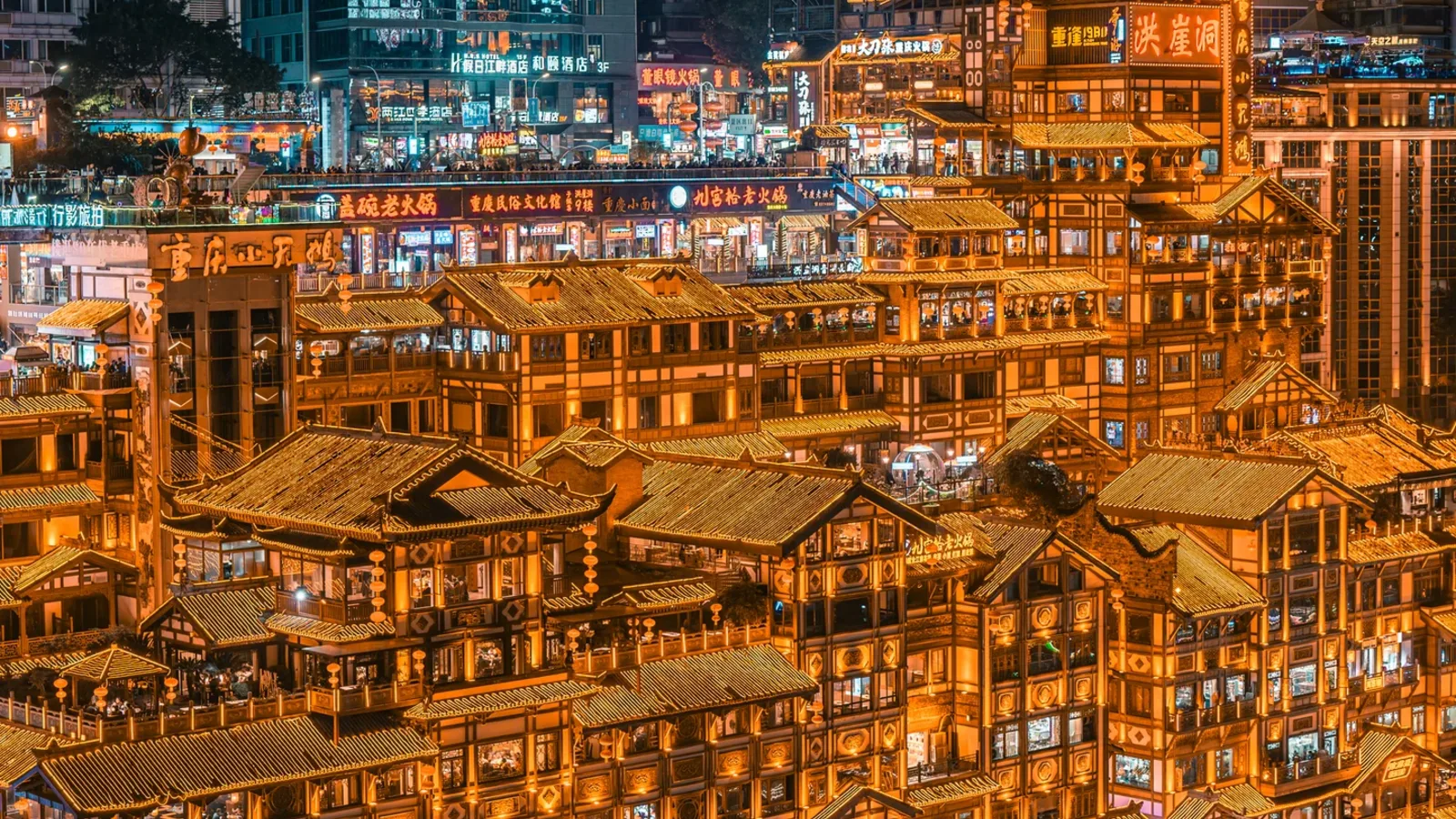 Hongya Cave illuminated on Chongqing's riverfront