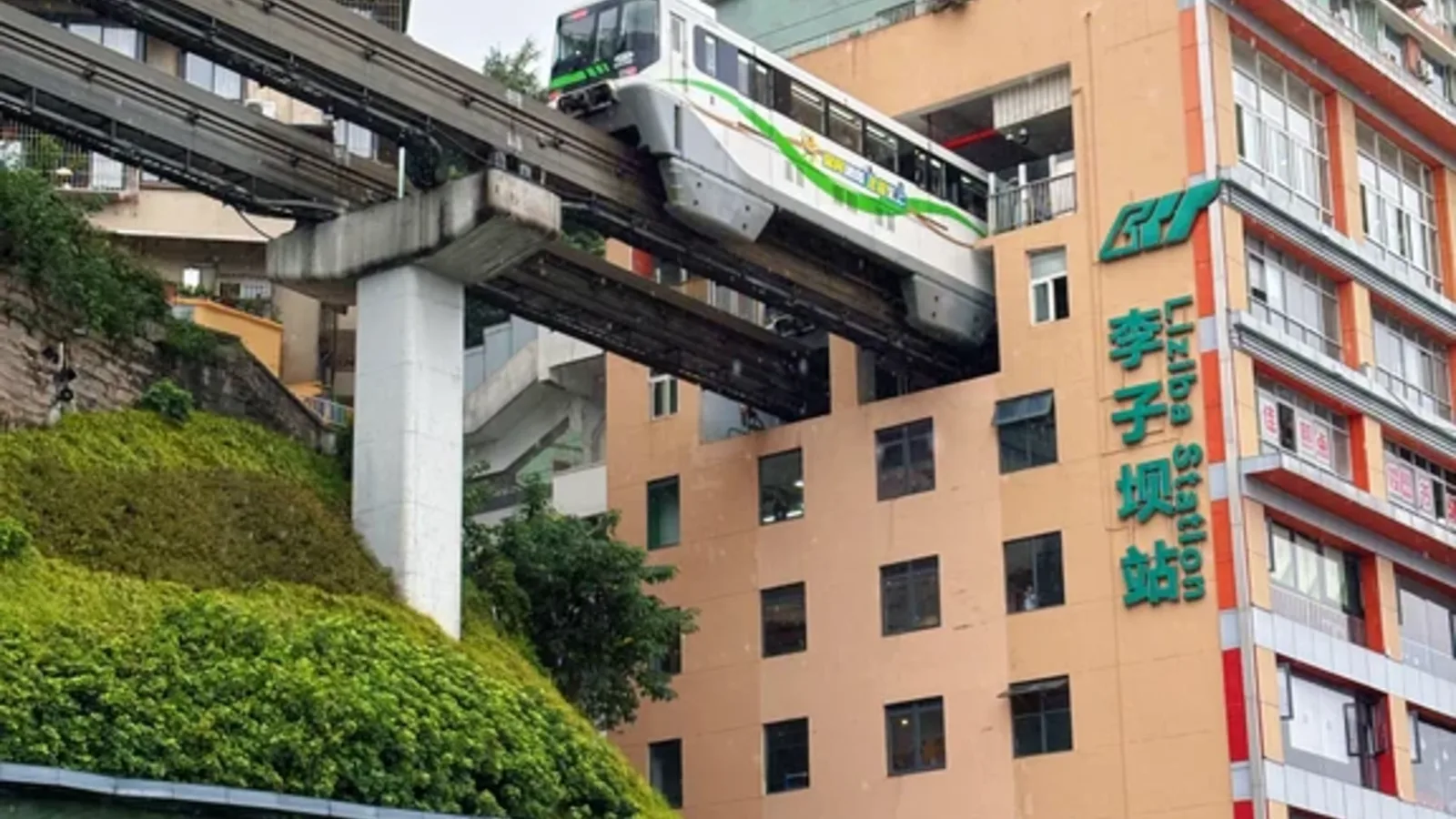 Chongqing rail transit train passing Liziba's hillside buildings