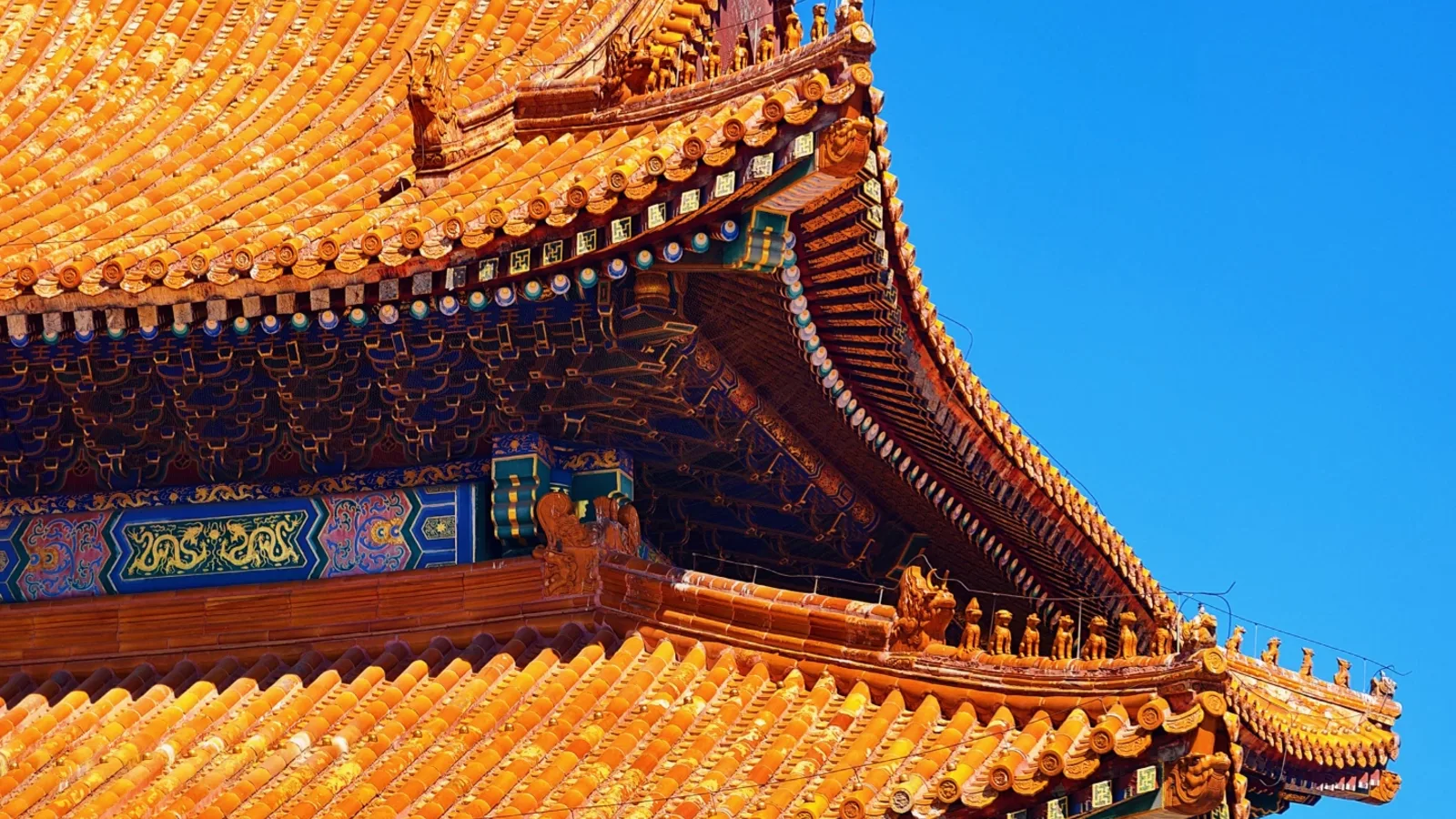 Golden roof details of a historic hall in Beijing's Forbidden City